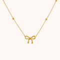 18kt Gold Plated Bead Chain Bow Charm Necklace - Manoune JEWELRY Belly_Jewelry Earrings - Navel_Ring - Necklace - Stud - Manoune_Jewelry - Belly_Ring - Navel_Jewelry Titanium Gold_Plated